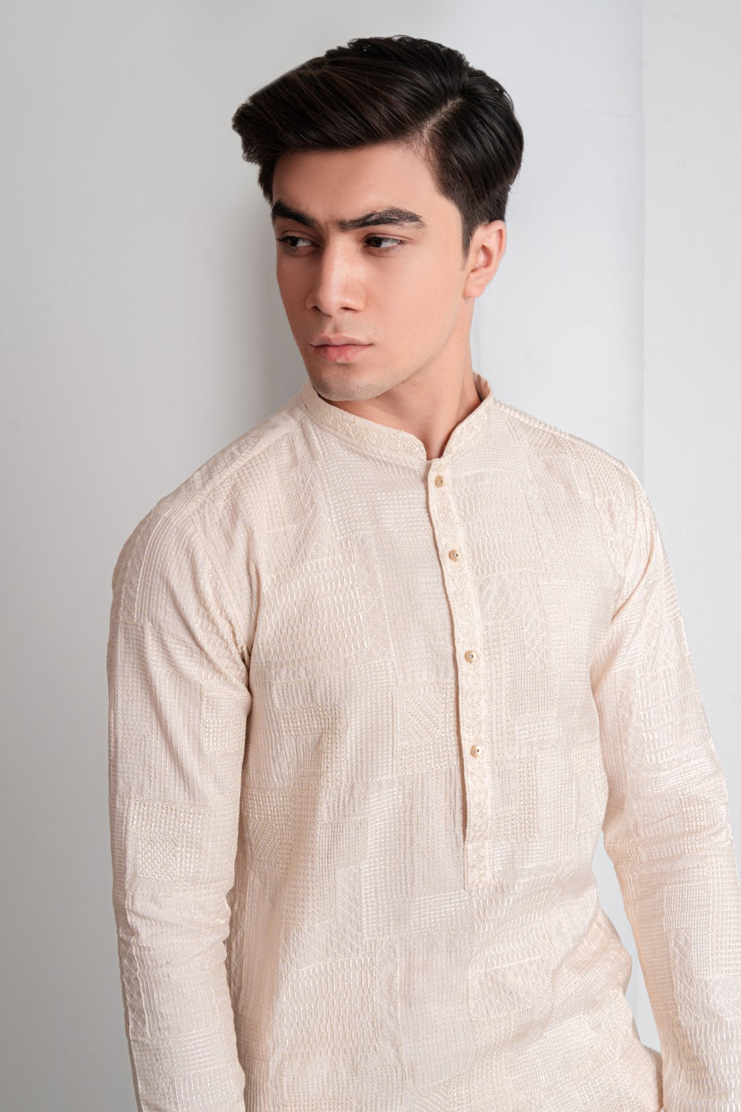Skin colour  patch work embroidered kurta and trouser.