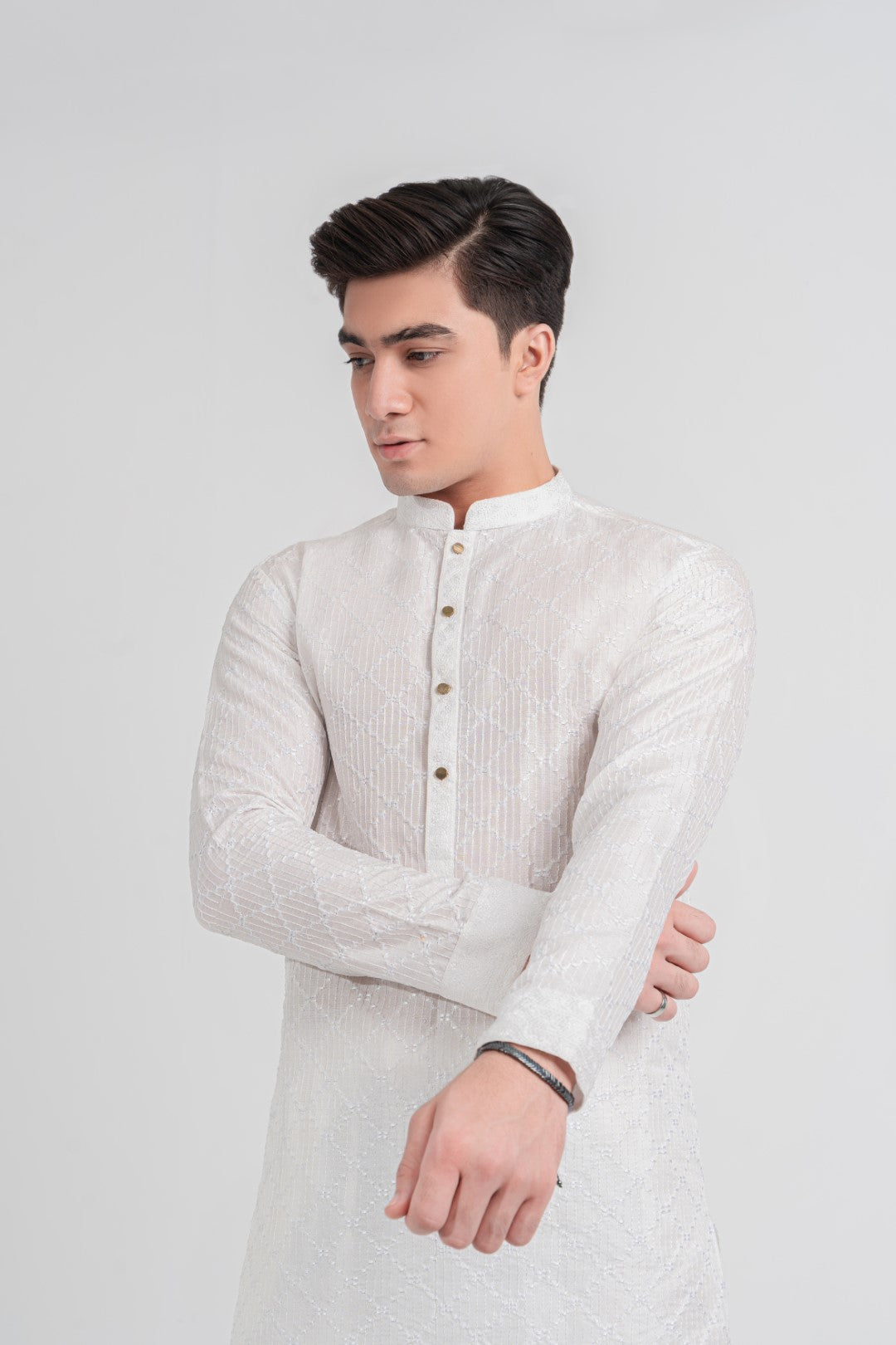 white cross design embroidered kurta and plain trouser.